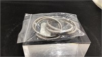 Five expandable silver bracelets