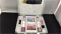 Makeup case with lipstick, nail polish, and more