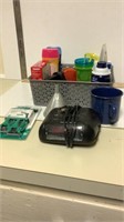Alarm clock radio,metal cup, funnel and toiletries