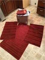 area rugs, box of linens and towels