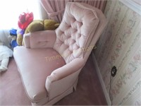 Swivel rocking chair in a rose colour