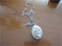 Sterling silver locket on unmarked chain