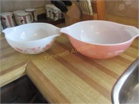 2 pink Pyrex bowls