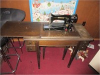 Sewing machine in cabinet and stool