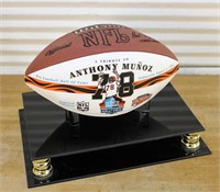 Signed Anthony Munoz football in case