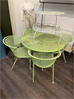 Green patio set and white two-tier table