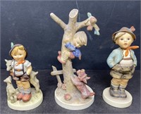Box of Goebel & Hummel figurines largest is