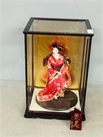 13" x  19" display cabinet w/ oriental doll
