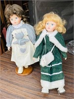 pair of 16" tall porcelain dolls on stands