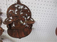 Carved wooden wall hanging by Dennis Atkins
