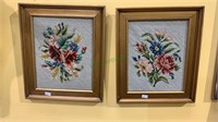 2 small framed needlepoint pieces of fabric.