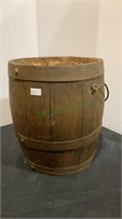 Antique beveled wood barrel with metal handle