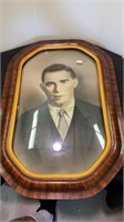 Vintage convex glass front wood frame with a