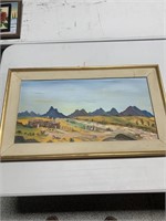 Desert mountain scene with farmstead
