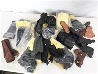 assorted holsters and cases