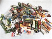 assorted fishing lures and maps