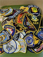 100 different police and fire patches