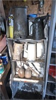 6-Oil Cans and white shelf unit