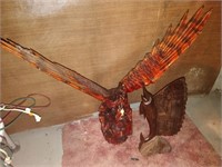 large bird and fish carving