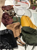 Bunch of purses in a laundry basket reselling