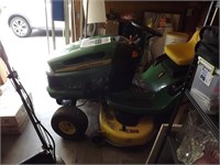 John Deere riding lawn mower