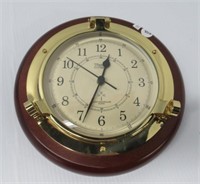 Porthole style radio control clock by Weens and