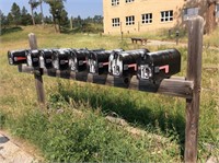 (8) mailboxes on stand