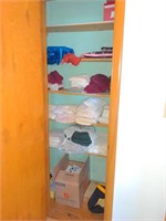 (B) Contents of closet including various linens