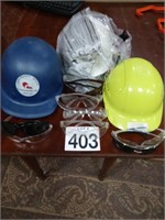 3  Construction hard hats and safety glasses