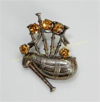 Sterling silver bagpipe brooch with yellow stones