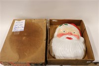 TWO PLASTIC LIGHT UP SANTA FACES WITH BOXES