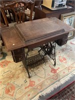 Antique oak treadle sewing machine