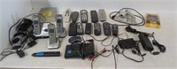 Assortment of Phones Power Cords, Tv Remotes, Bar
