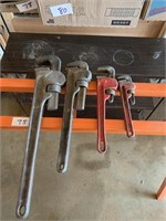 FOUR PIPE WRENCHES