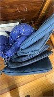 Large bin of cushions and blanket
