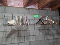 CLOTHES HANGERS ON BAR
