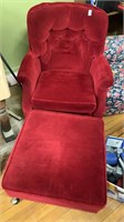 Red cushioned chair with ottoman