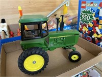 John Deere Ertl diecast toy tractor with cab 1/64