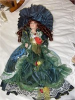 Porcelain doll in blue dress