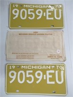 Pair NOS Michigan License Plates with Sleeve.