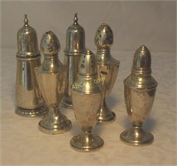 6 Sterling salt and pepper shakers. 4 are