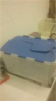 Clear rubber storage crate with blue folding lid