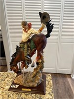 Vintage cowboy on horse statue