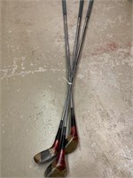 3 Wilson Golf Clubs.