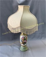 Porcelain table lamp with fringed lampshade