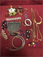 24 pieces of assorted costume jewelry. Necklaces,