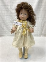 Porcelain doll with porcelain head. Hand painted.