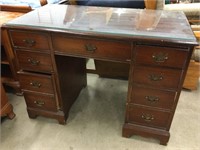 Desk with glass top.  30” tall x 42” wide x 22”