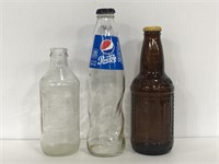 Three vintage glass pop bottles