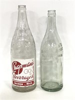 Two large vintage glass Michigan bottles